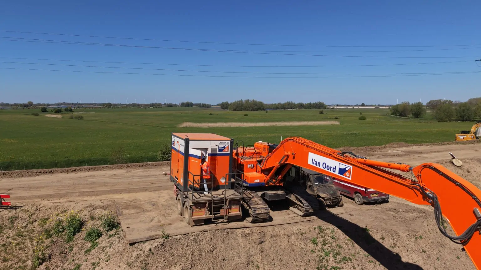 DIgger and battery container at construction site