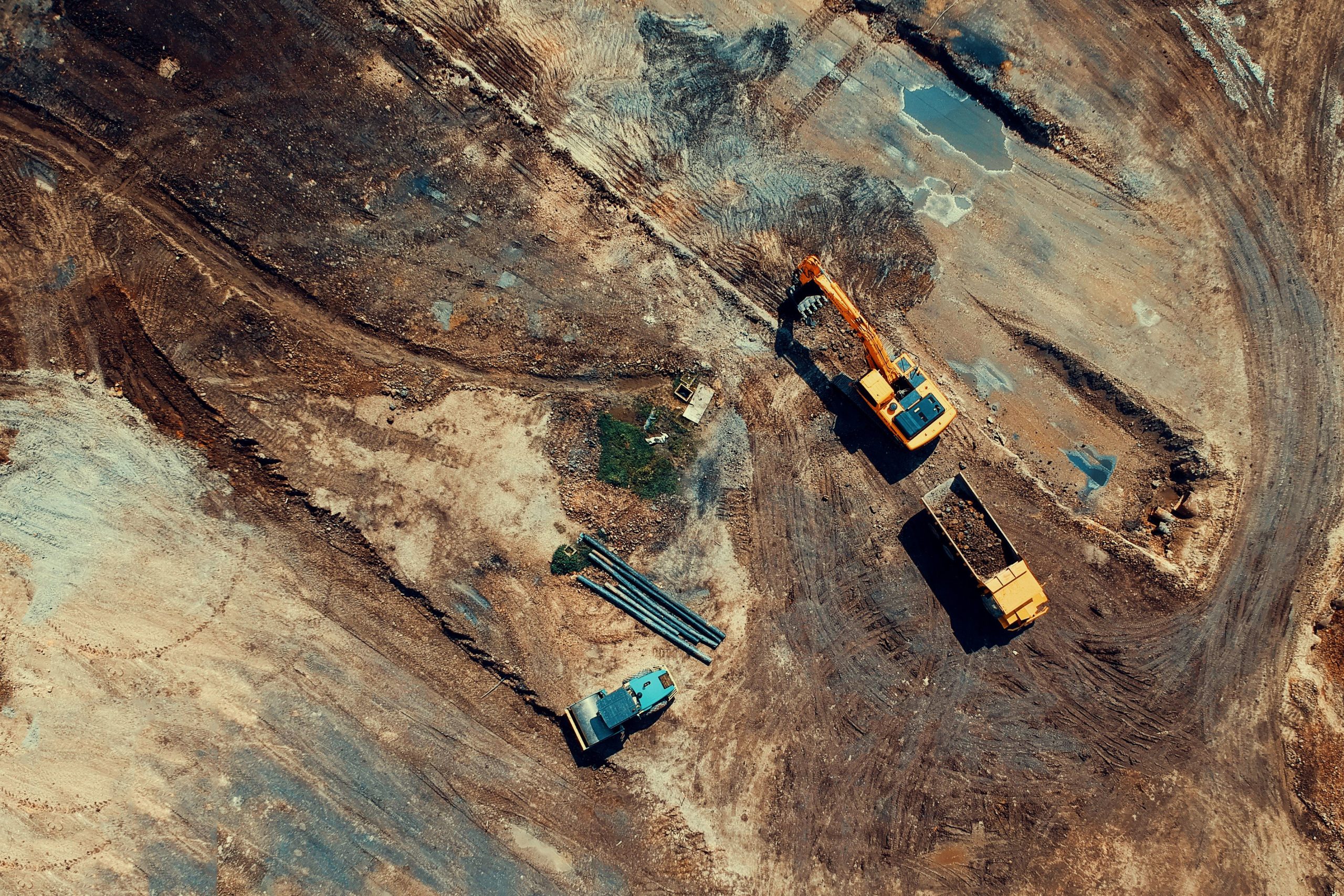 Construction site with escavator and truck